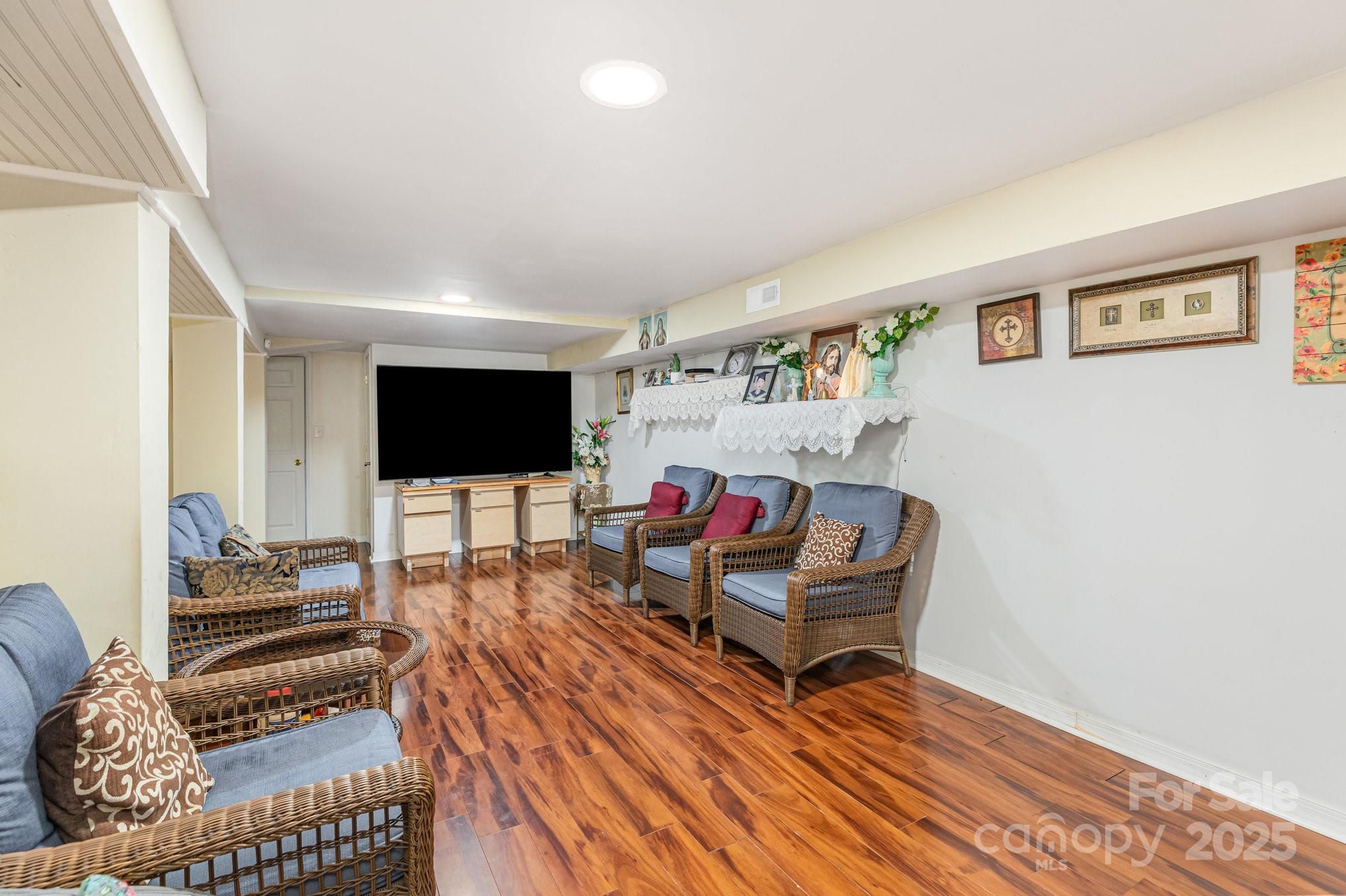 9716 Sunway Drive Mint Hill, NC 28227 - Photo 7 of 31 a living room with furniture and a flat screen tv