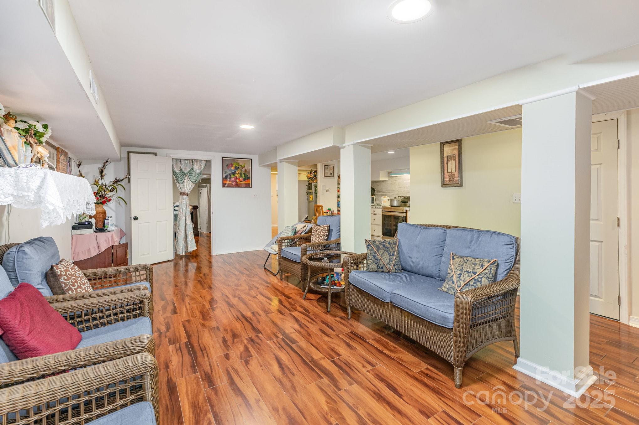 9716 Sunway Drive Mint Hill, NC 28227 - Photo 8 of 31 a living room with furniture and a wooden floor
