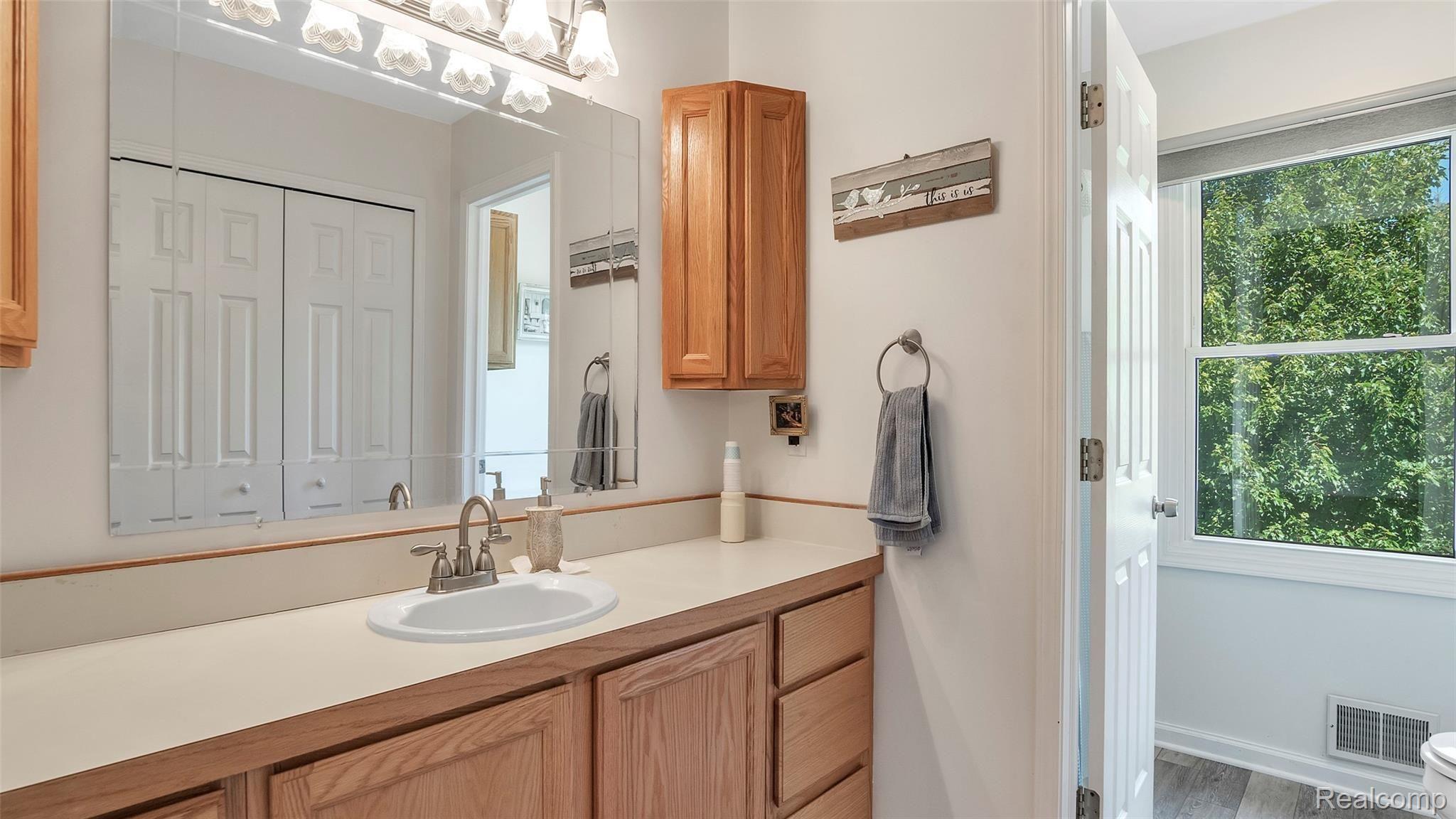 6063 Rivers Edge Drive Howell, MI 48855 - Photo 18 of 39 2nd full bath, storage galore.