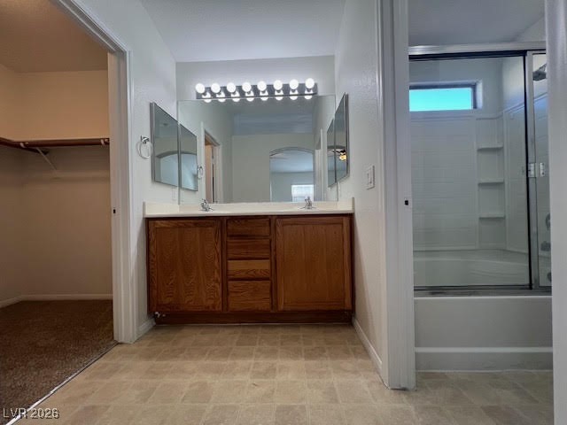 8229 Strawberry Spring Street Las Vegas, NV 89143 - Photo 27 of 40 Bathroom with double vanity, bath / shower combo with glass door, a spacious closet, and light flooring
