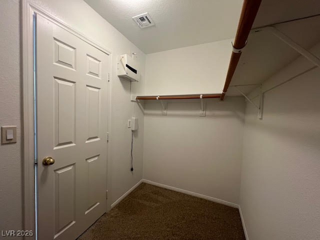 8229 Strawberry Spring Street Las Vegas, NV 89143 - Photo 30 of 40 Walk in closet featuring dark colored carpet