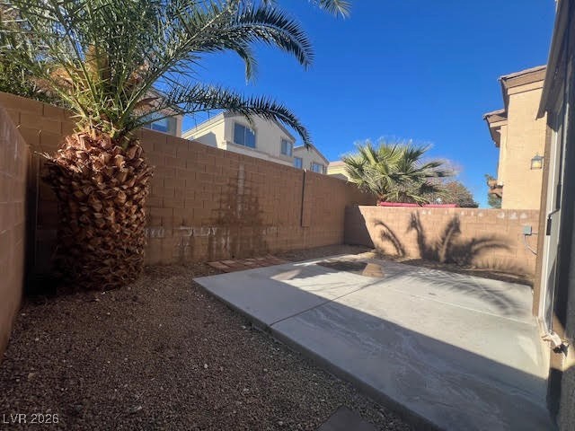 8229 Strawberry Spring Street Las Vegas, NV 89143 - Photo 35 of 40 Fenced backyard featuring a patio area