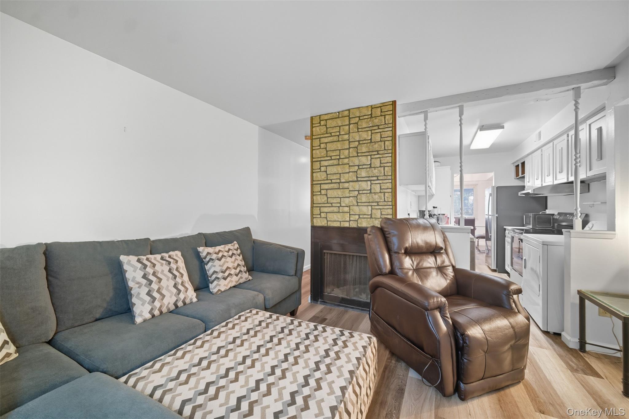 24 Wooded Way Calverton, NY 11933 - Photo 11 of 29 a living room with furniture and a large window