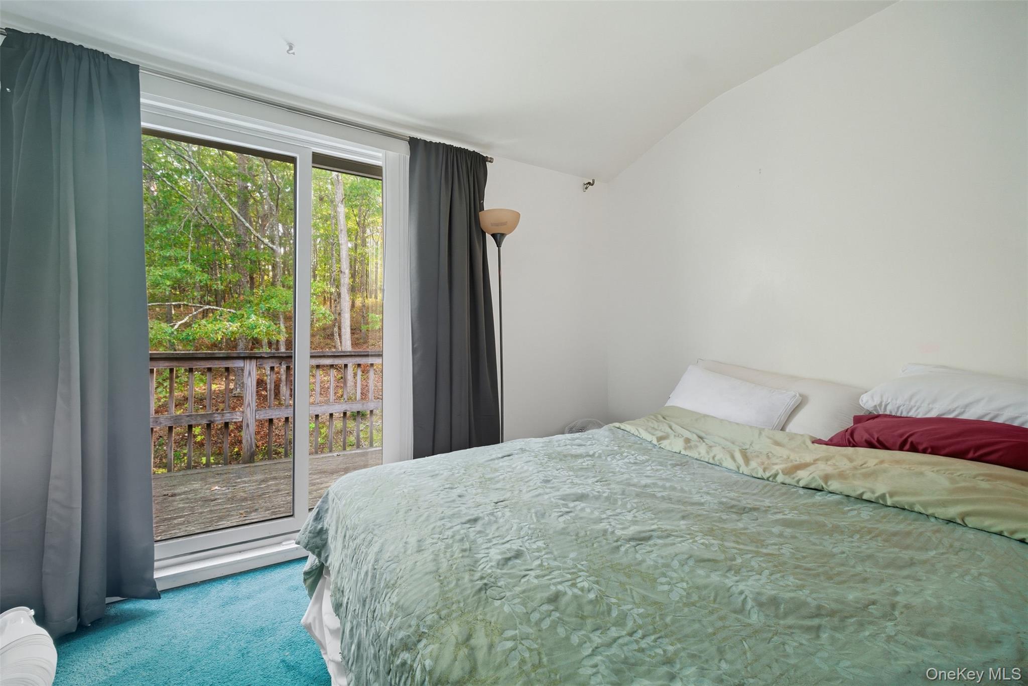 24 Wooded Way Calverton, NY 11933 - Photo 16 of 29 a bedroom with a bed and a large window