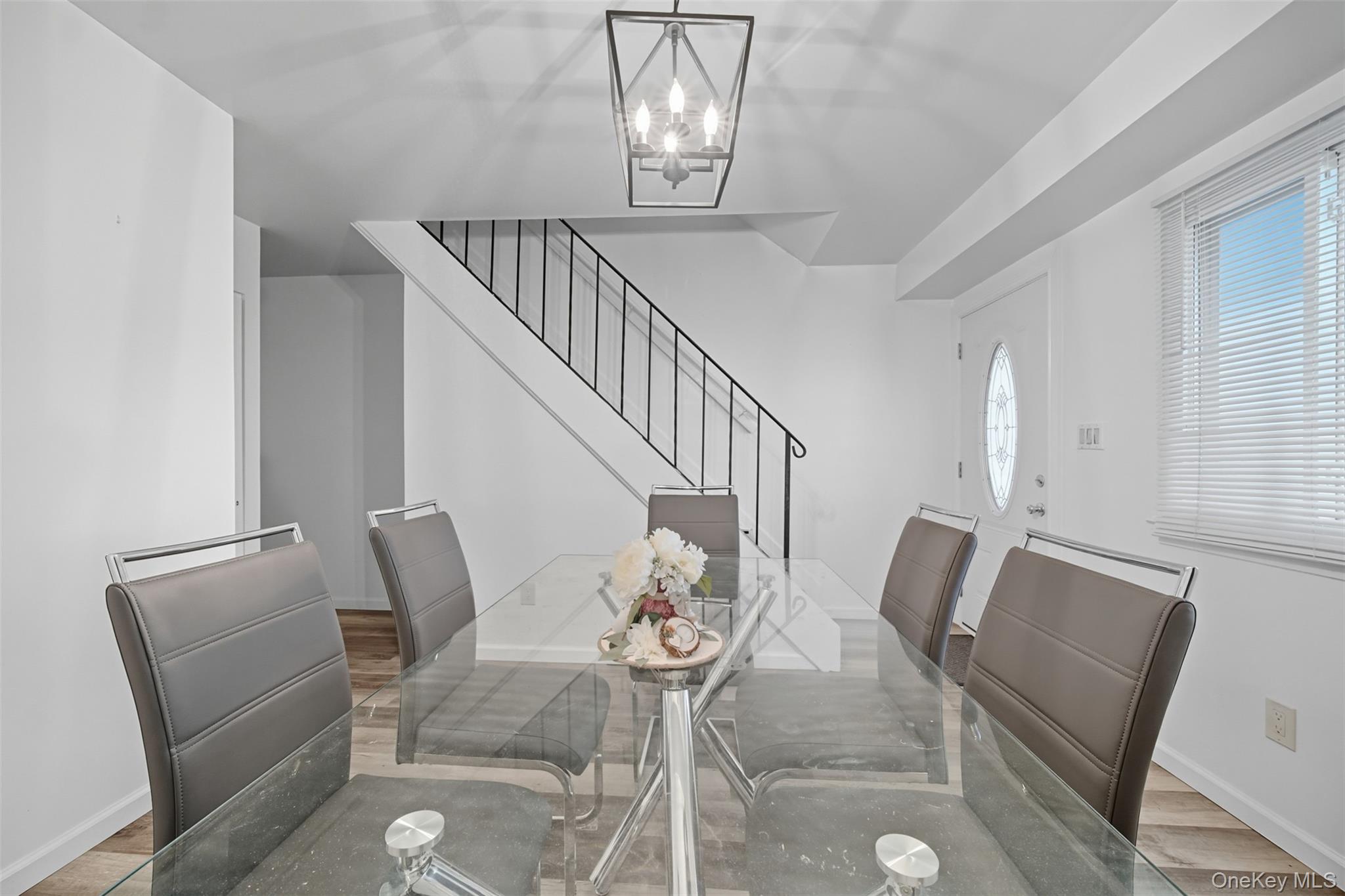 24 Wooded Way Calverton, NY 11933 - Photo 4 of 29 a view of livingroom and dining room with furniture