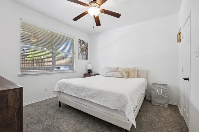 a bedroom with a bed and window