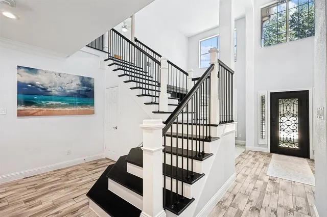a view of entryway with wooden floor