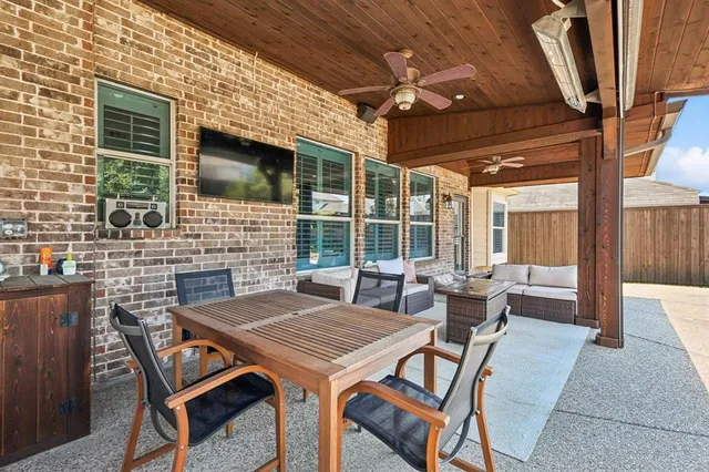 a outdoor space with a couch and wooden floor