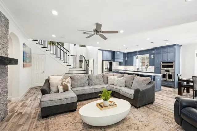 a living room with furniture and a fireplace