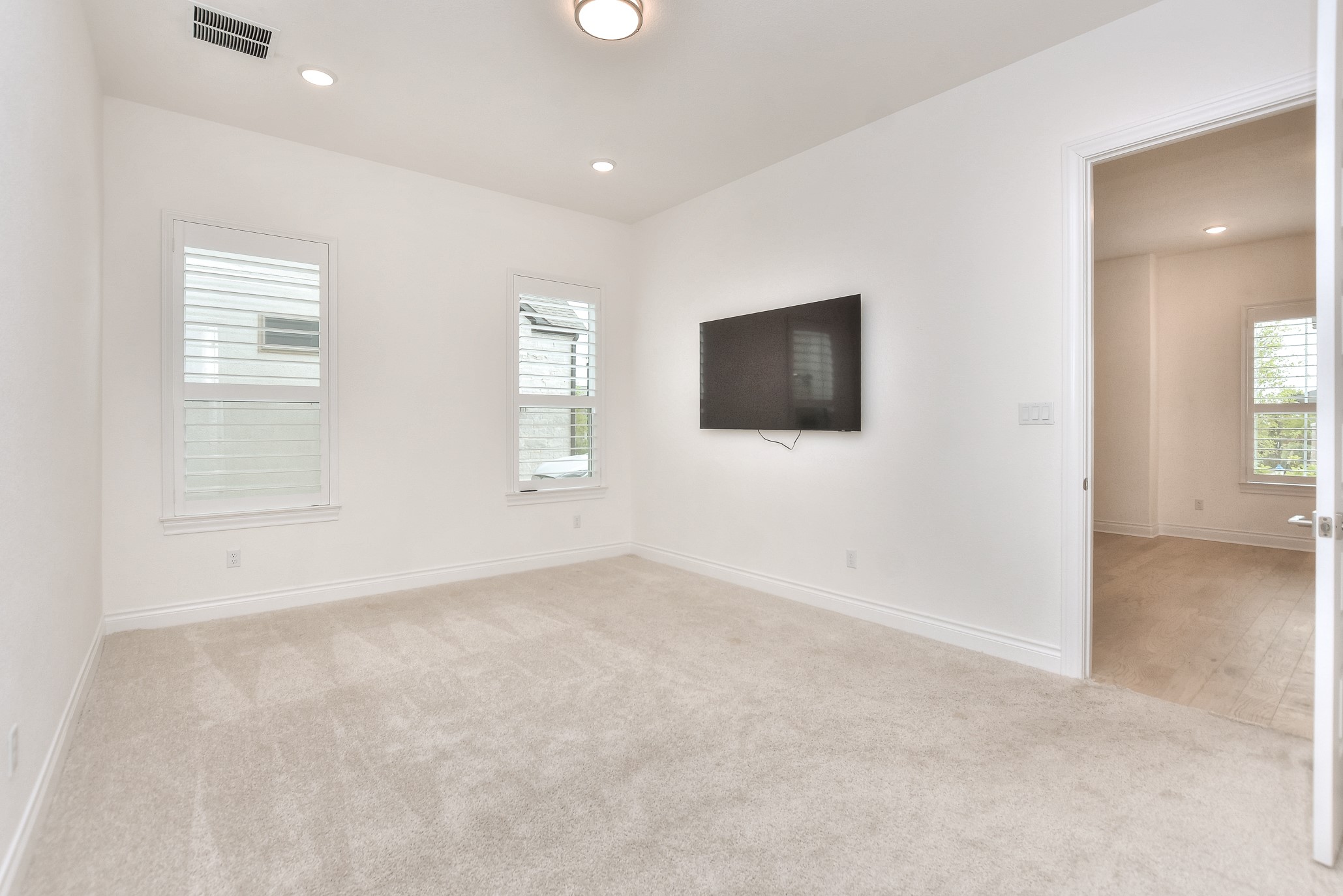 309 Wolf Rdg Road Georgetown, TX 78628 - Photo 27 of 39 Spare room featuring light colored carpet and recessed lighting