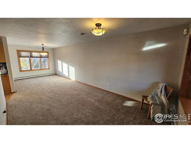a black and white photo of a living room