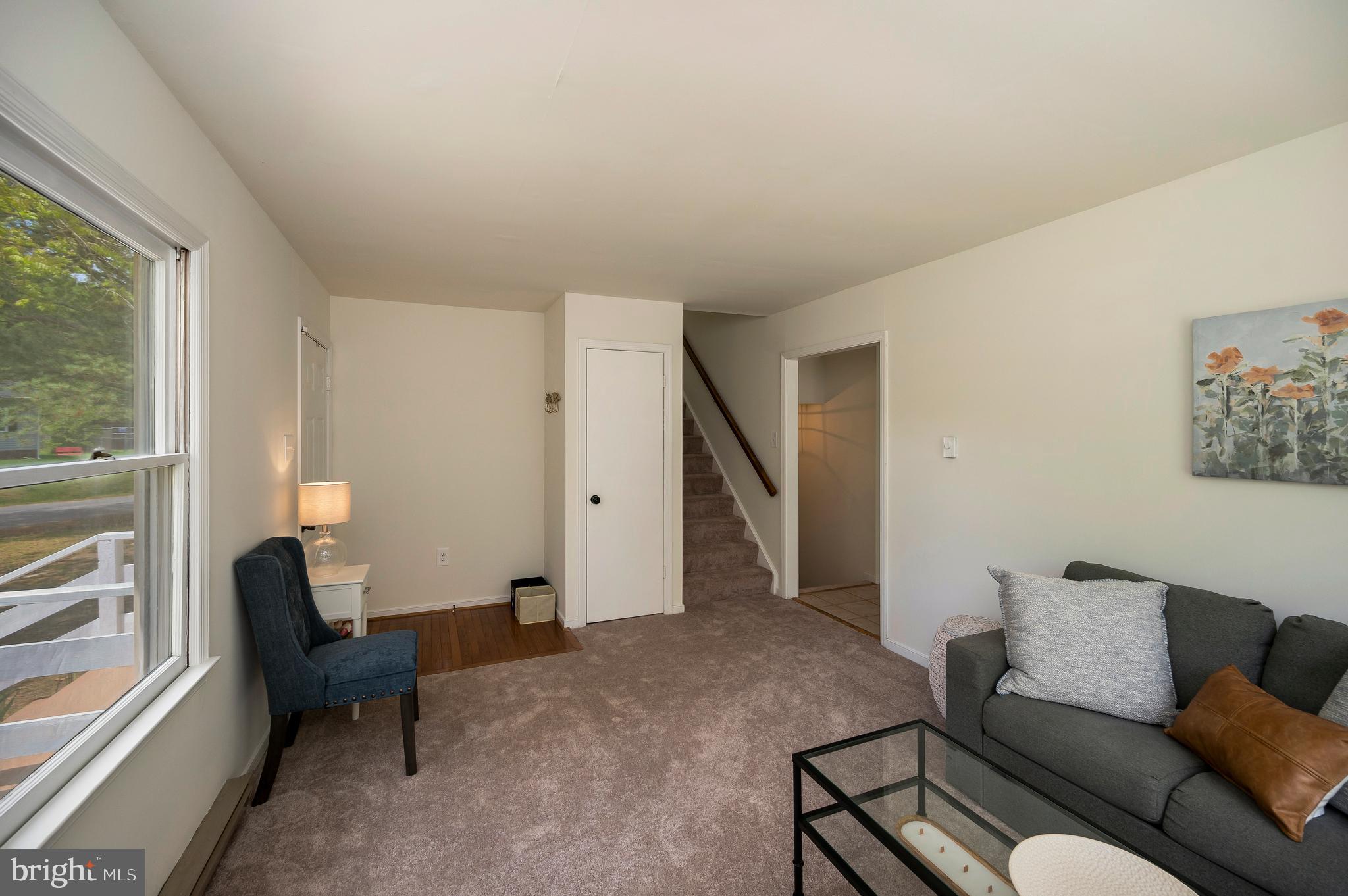 2601 Deerfield Road Ruther Glen, VA 22546 - Photo 11 of 51 Living room with stairs and closet
