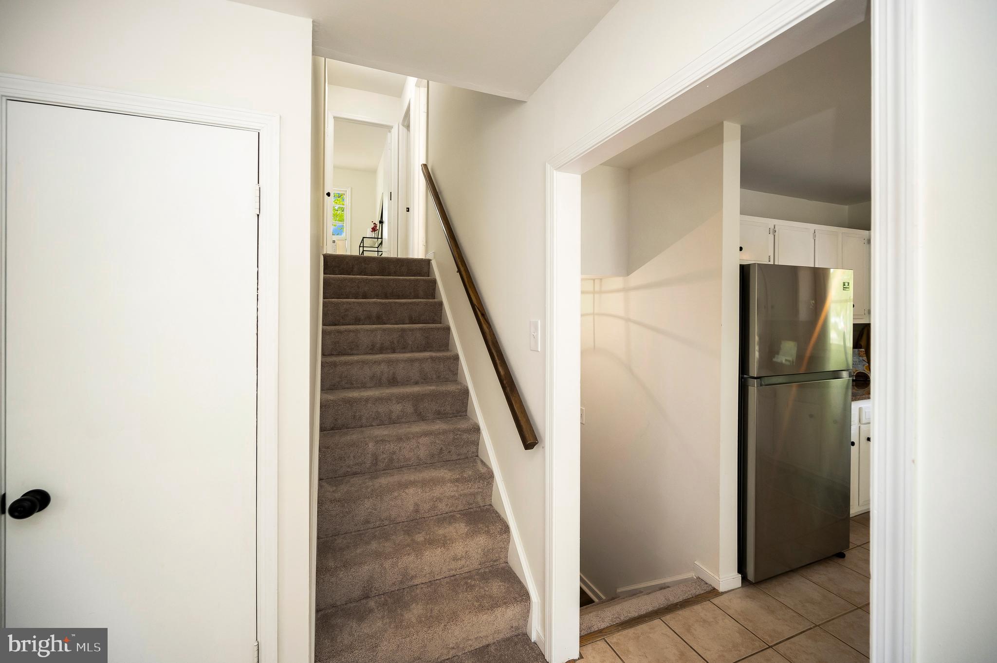 2601 Deerfield Road Ruther Glen, VA 22546 - Photo 12 of 51 Carpeted stairs to upper and lower levels