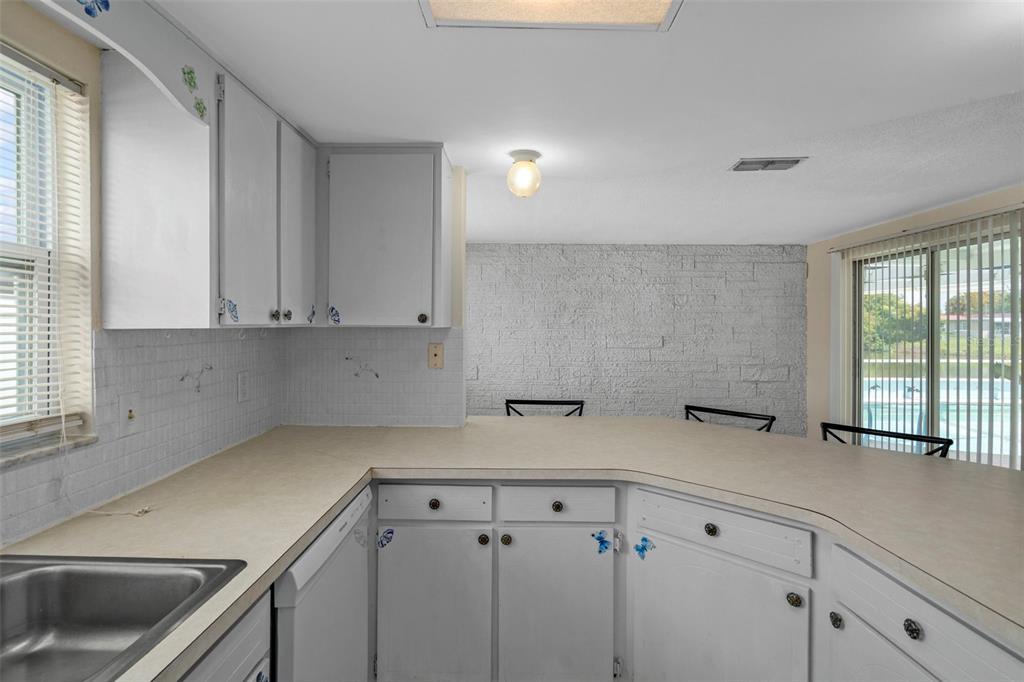 7403 Populus Drive Port Richey, FL 34668 - Photo 24 of 50 a view of a kitchen with cabinets