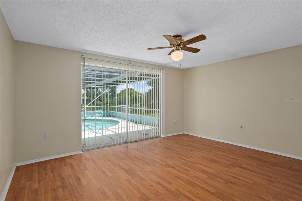 7403 Populus Drive Port Richey, FL 34668 - Photo 29 of 50 a view of a room with wooden floor and a window