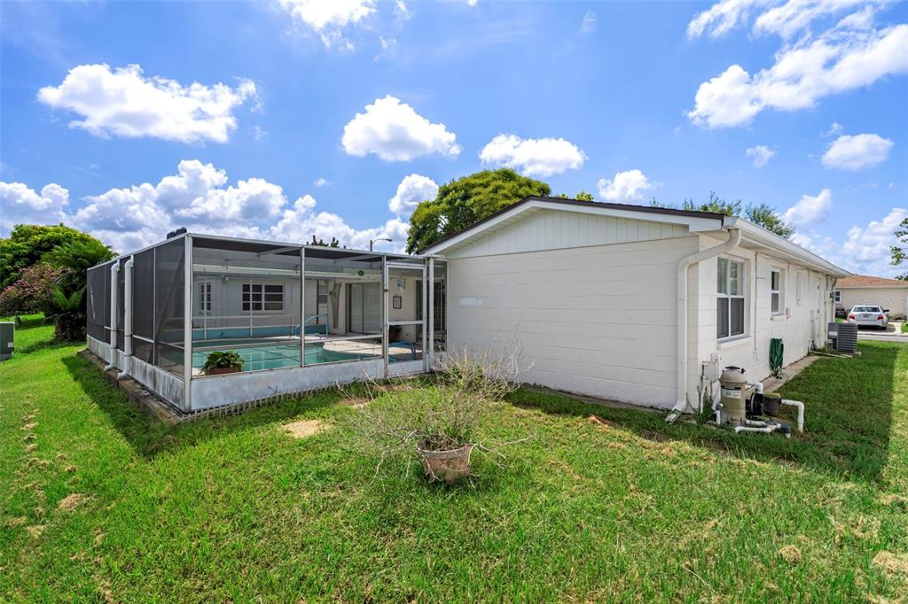 7403 Populus Drive Port Richey, FL 34668 - Photo 48 of 50 a view of a house with backyard and sitting area