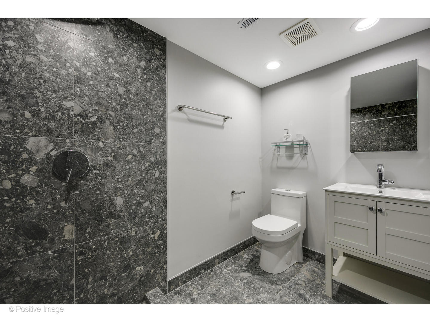 737 Valley Road Lake Forest, IL 60045 - Photo 11 of 17 a bathroom with a toilet a sink and mirror