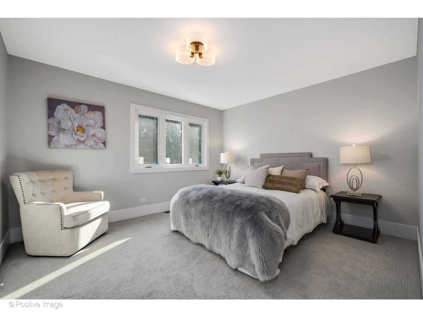 737 Valley Road Lake Forest, IL 60045 - Photo 9 of 17 a bedroom with a bed and a couch