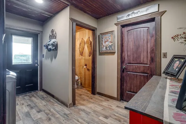 a view of hallway with wooden floor