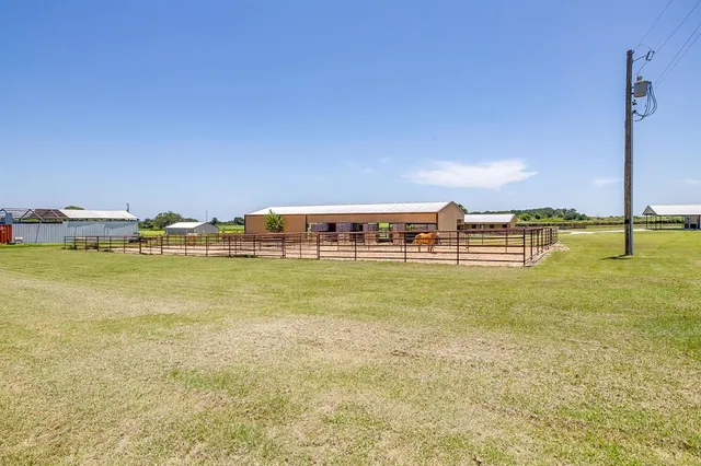 a view of a swimming pool with an outdoor seating