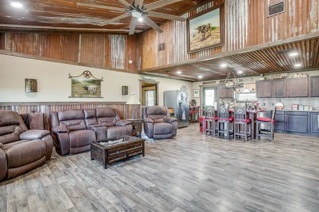 a living room with lots of furniture and a chandelier