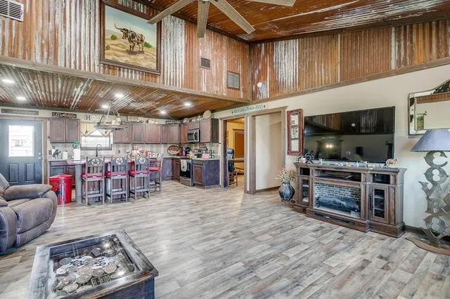 a living room with furniture and a flat screen tv