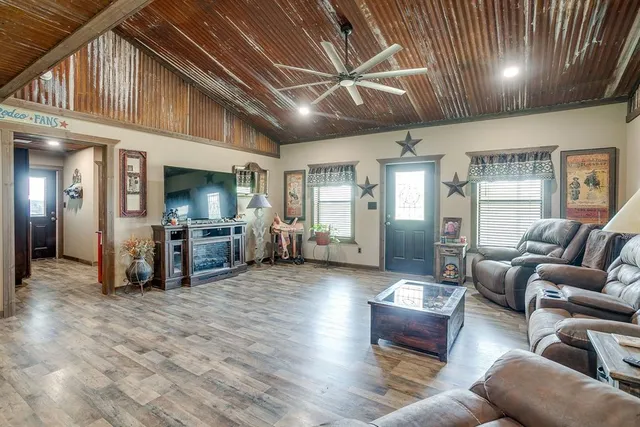 a living room with furniture and a large window