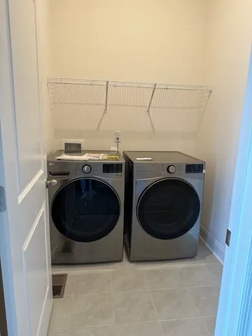 a utility room with dryer and washer