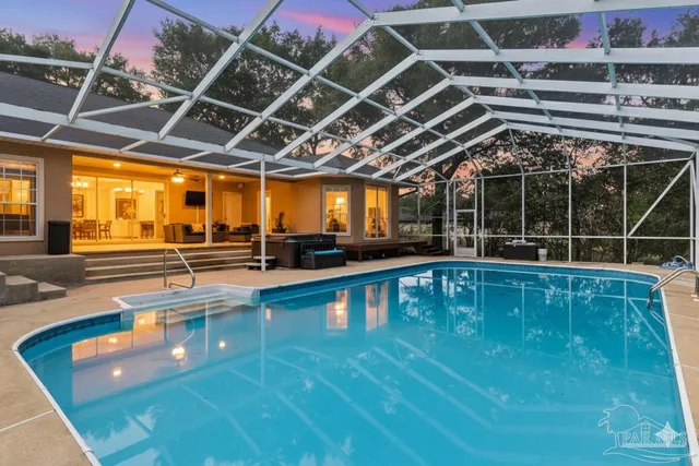 a view of a swimming pool with a patio