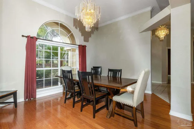 a kitchen with center island table and chairs