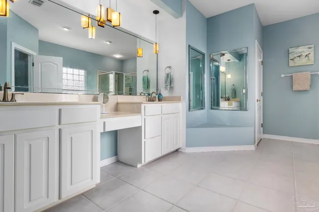 a view of a work space with wooden floor and furniture