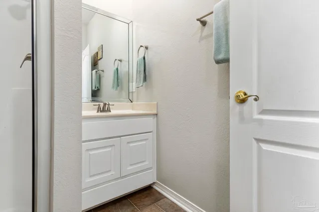 a bedroom with furniture and a chandelier