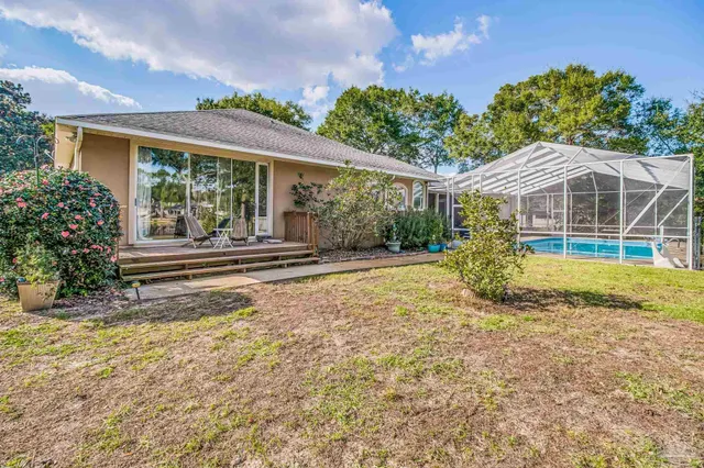 a view of a patio with a table and chairs