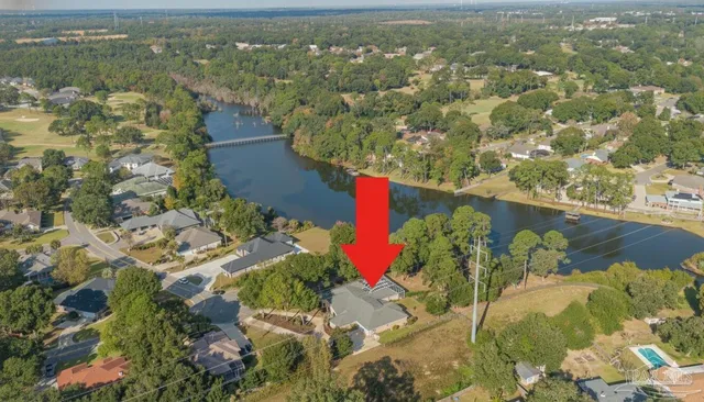 a view of a swimming pool with a glass door