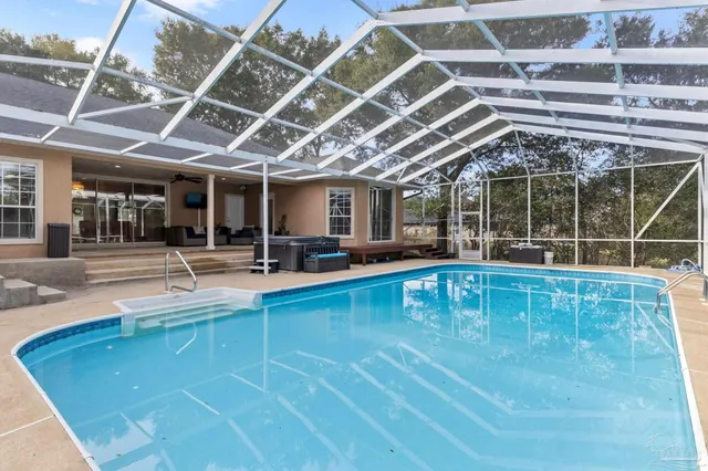 a view of living room with furniture and windows