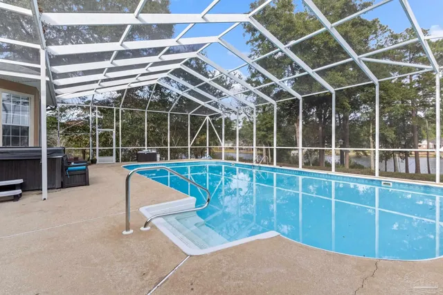 a view of an ocean with a house in the background