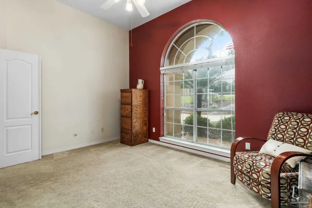 a kitchen with stainless steel appliances a stove top oven a refrigerator a sink and dishwasher with wooden floor