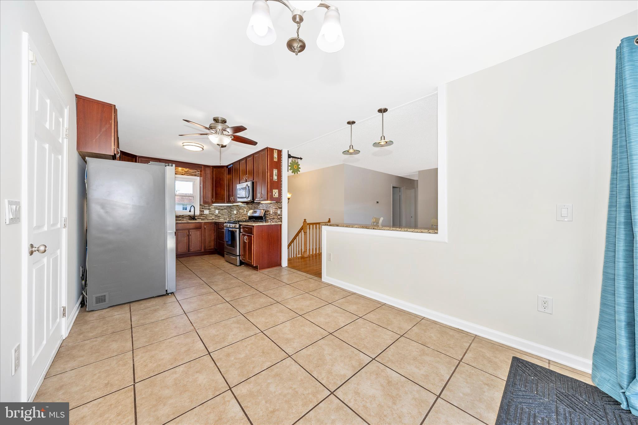 1606 Wise Road Point of Rocks, MD 21777 - Photo 12 of 67 a kitchen with stainless steel appliances kitchen island granite countertop a refrigerator and a stove top oven