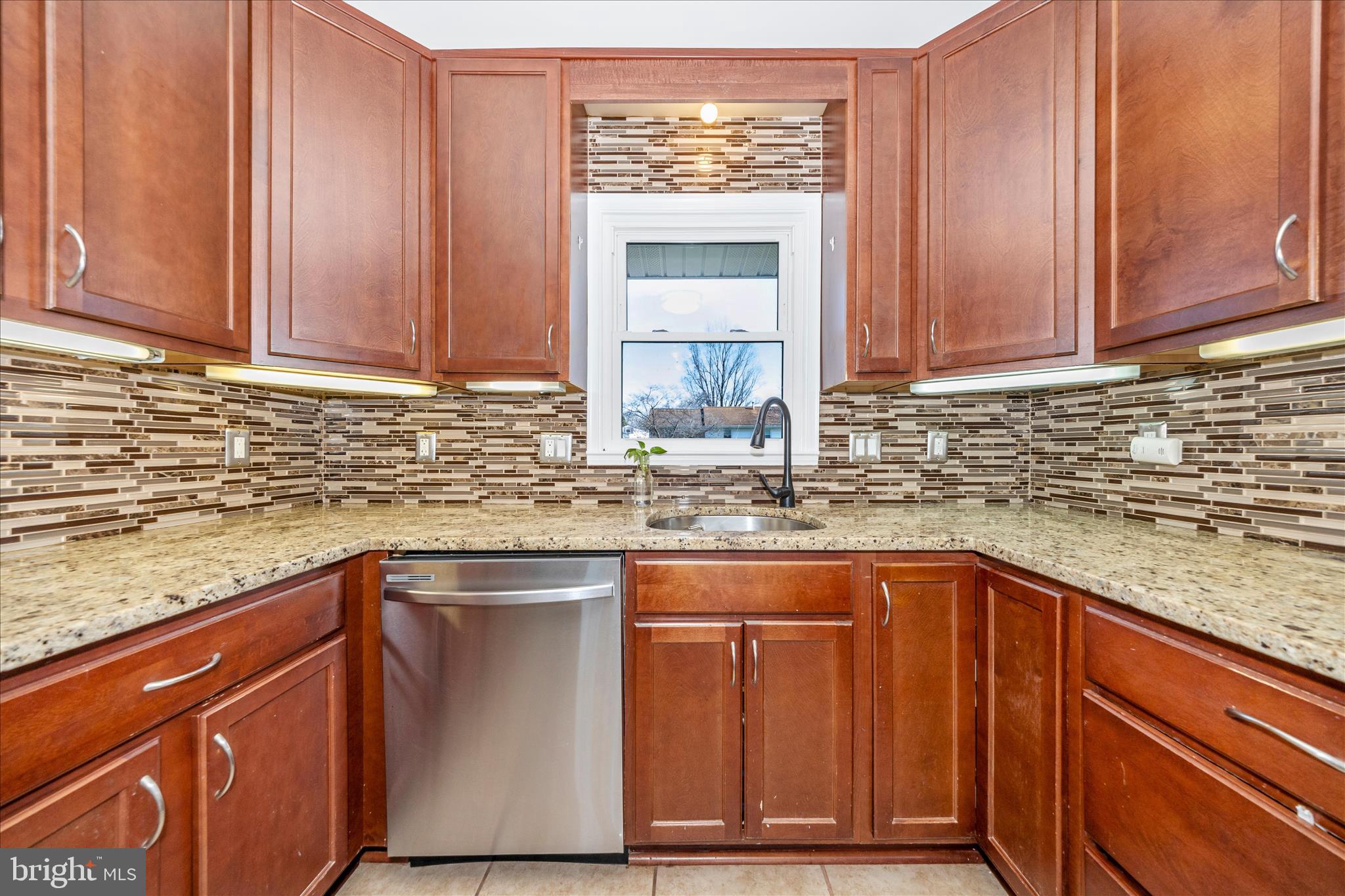 1606 Wise Road Point of Rocks, MD 21777 - Photo 16 of 67 a kitchen with stainless steel appliances granite countertop wooden cabinets a sink and dishwasher