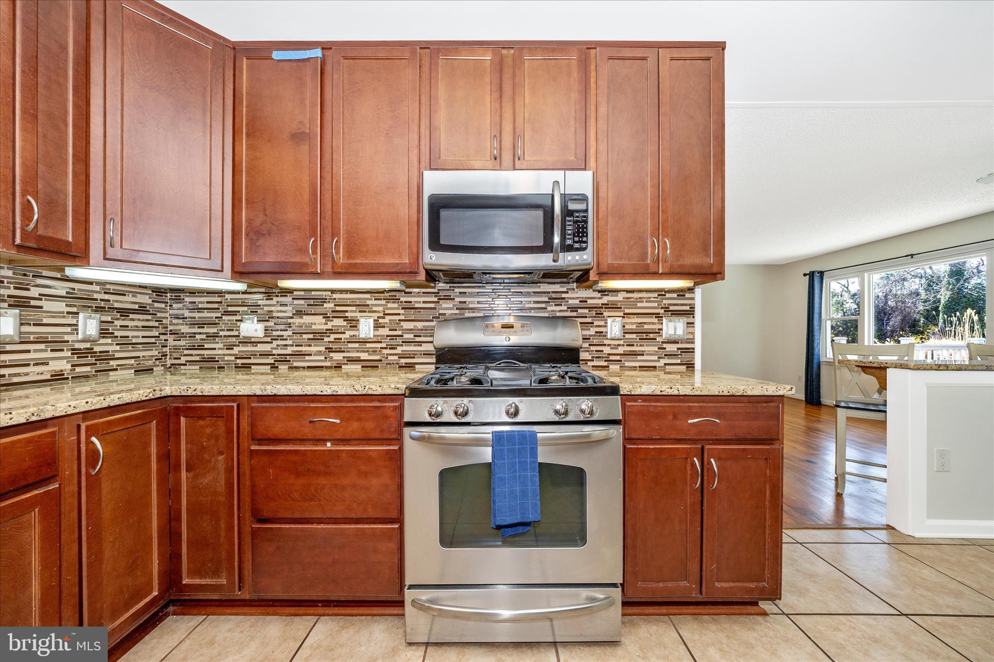 1606 Wise Road Point of Rocks, MD 21777 - Photo 17 of 67 a kitchen with granite countertop wooden cabinets and stainless steel appliances