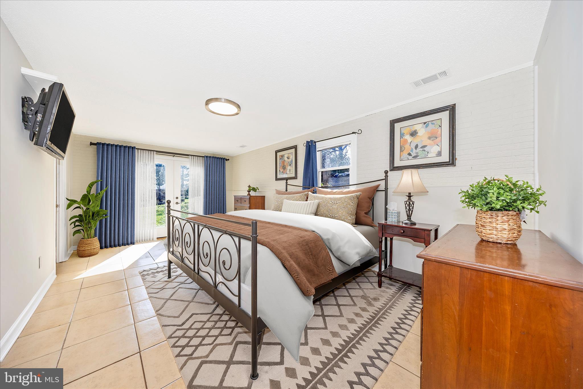 1606 Wise Road Point of Rocks, MD 21777 - Photo 30 of 67 a spacious bedroom with a bed and a chandelier