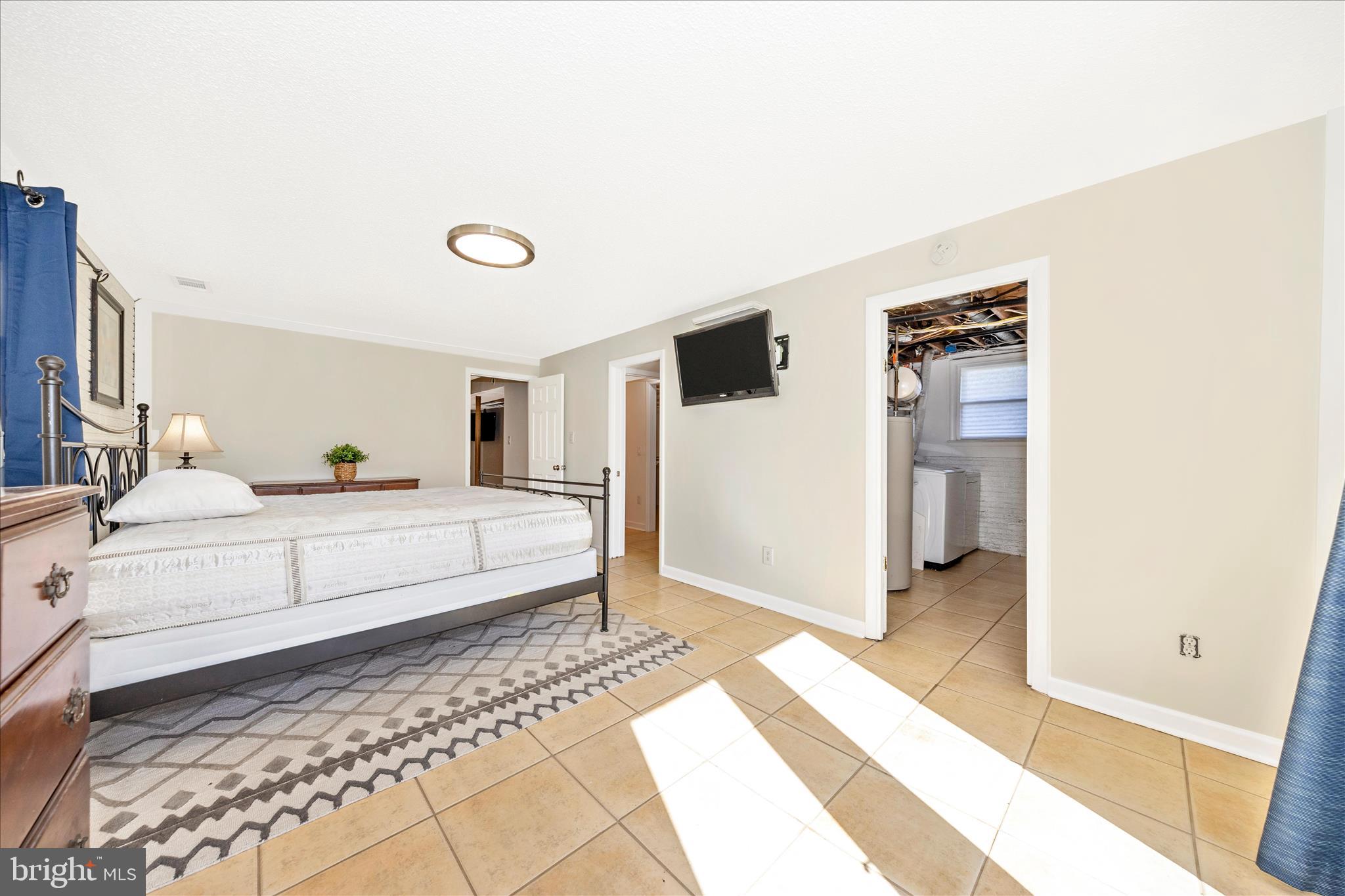 1606 Wise Road Point of Rocks, MD 21777 - Photo 33 of 67 a spacious bedroom with a bed and a walk in closet