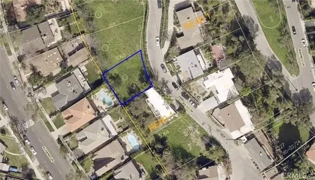 a aerial view of a house with a yard