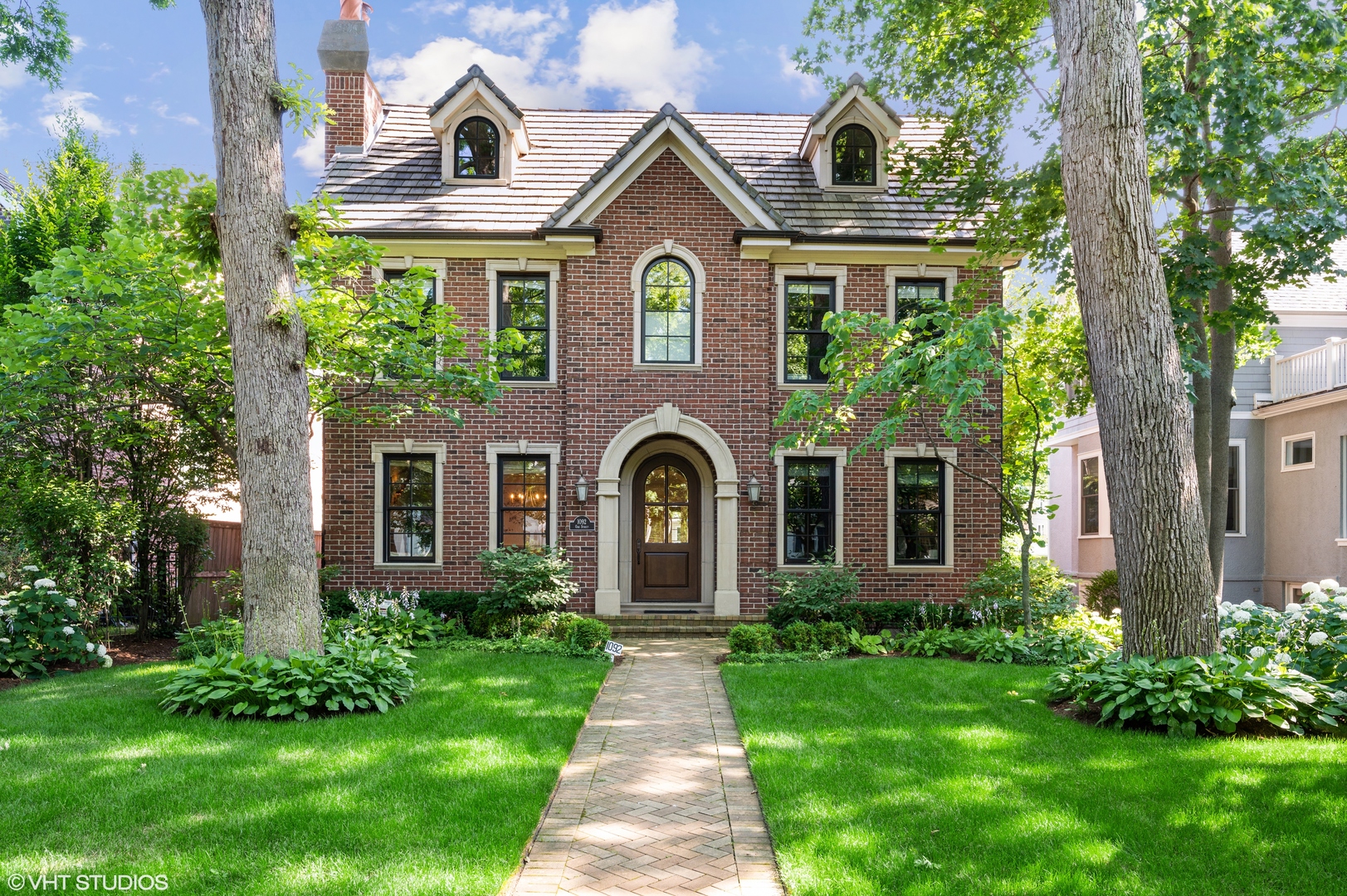 1092 Oak Street Winnetka, IL 60093 - Photo 1 of 1 a front view of a house with garden