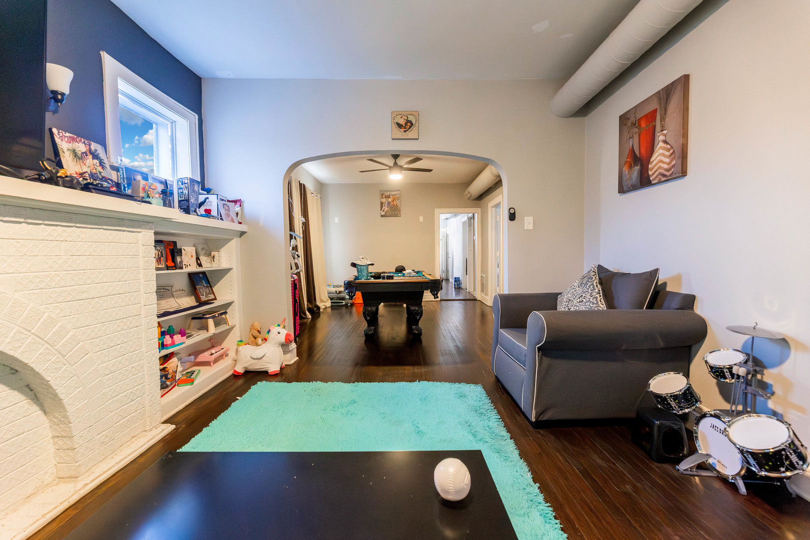 12258 South Normal Avenue Chicago, IL 60628 - Photo 12 of 21 a living room with furniture and a baby crib
