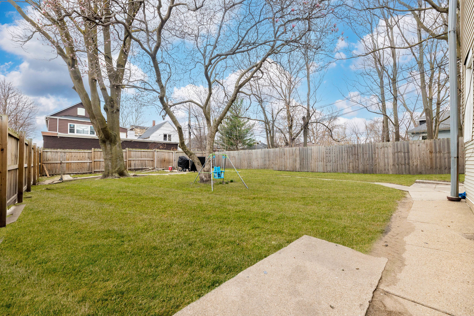 12258 South Normal Avenue Chicago, IL 60628 - Photo 19 of 21 a view of a yard with a tree