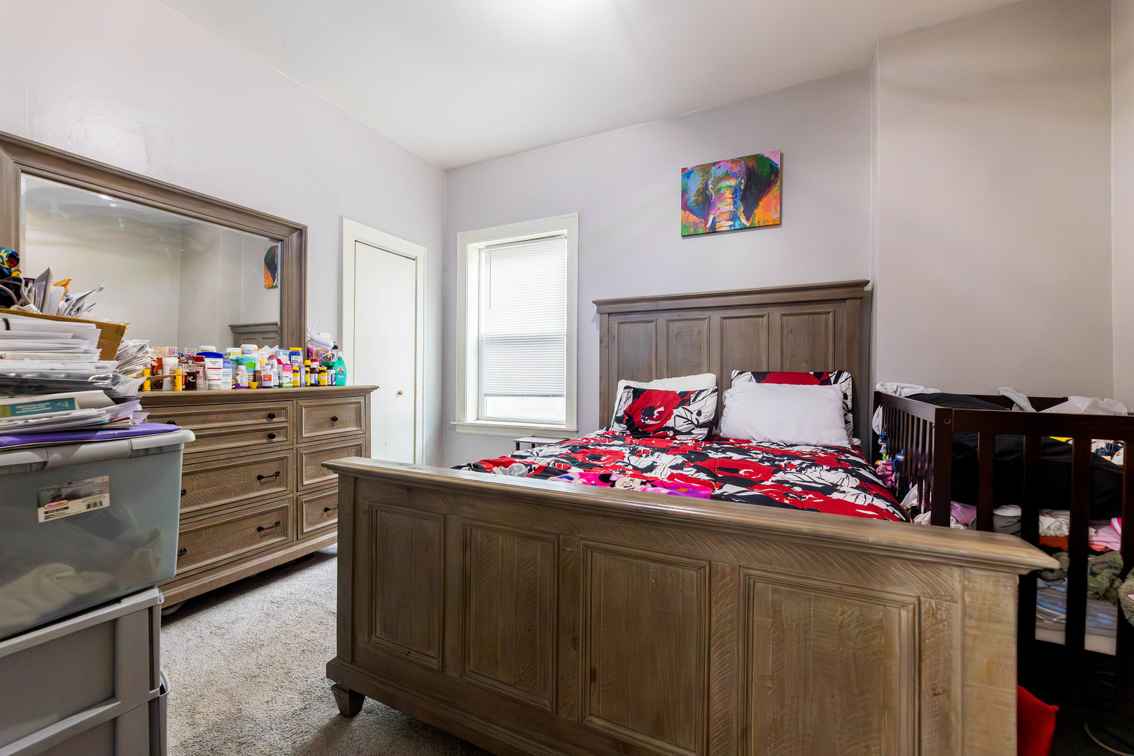 12258 South Normal Avenue Chicago, IL 60628 - Photo 8 of 21 a bedroom with a bed and cabinets