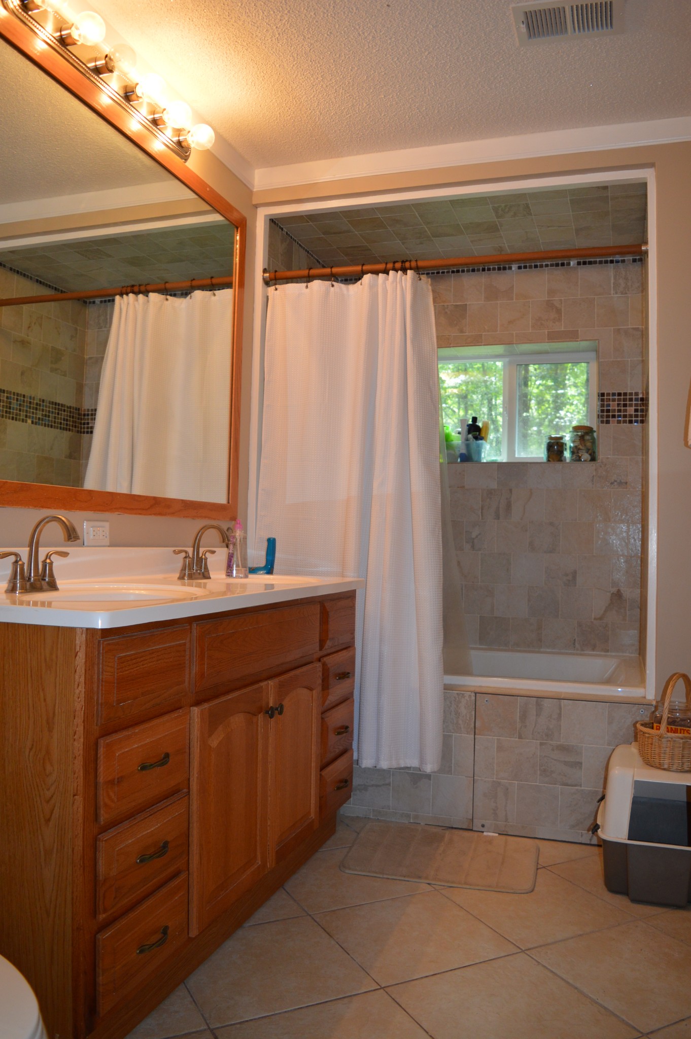 197 Midway Road Sewanee, TN 37375 - Photo 13 of 15 a bathroom with a double vanity sink and a bathtub