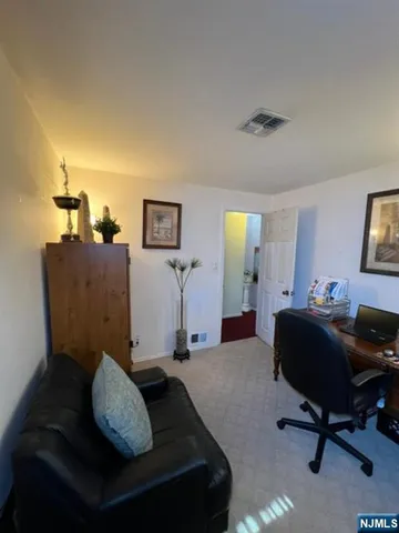 a living room with furniture and a chair