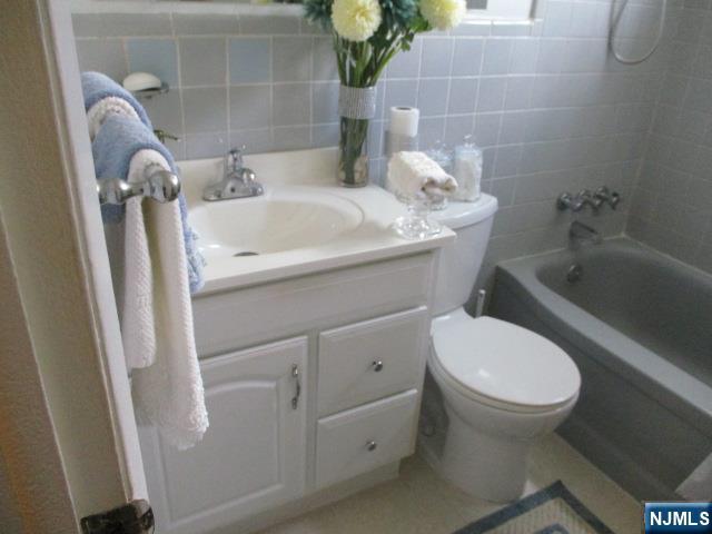 26 Donna Court Nutley, NJ 07110 - Photo 17 of 34 a bathroom with a sink and toilet